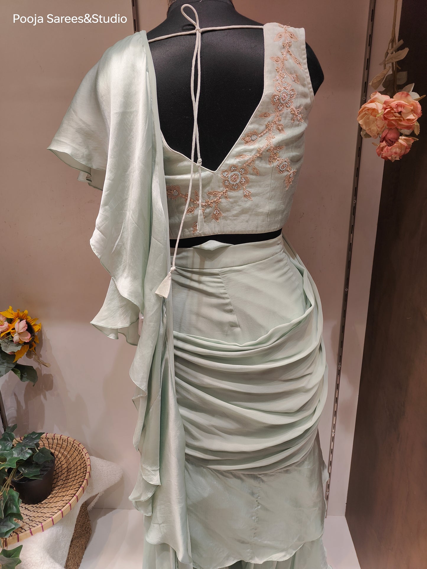 AARSAA Pista Green Crepe Applique Katdana Sleevless Blouse with Fishcut 3 layered drape lehenga